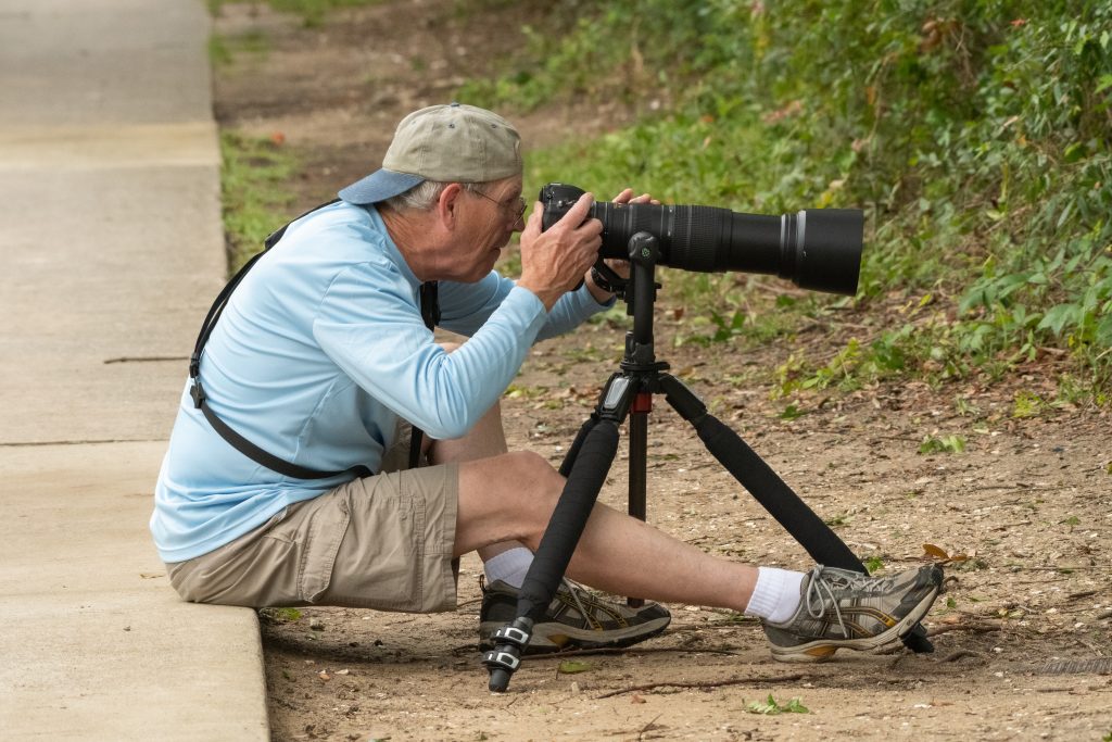 Photographe avec un trépied
